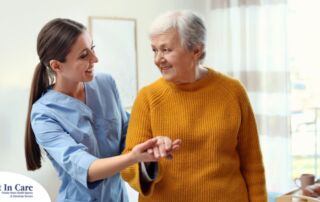 Professional caregivers, like this one who is helping a senior client walk, require a number of qualities and skills to provide compassionate personal care.