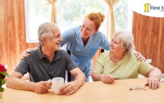 A good caregiving environment can benefit both caregiver and clients, as shown here by this caregiver and her 2 clients.