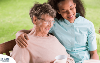 Professional caregivers like this one who is reading a book with a senior client can help them stay mentally active and engaged.