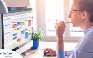 A woman looks at her calendar on her computer, showing an example of a time management tool that can help caregivers.